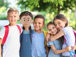 A picture of children hugging with a child System C character.