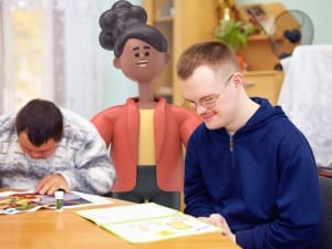 A picture of 2 young people drawing with a System C character in the background.