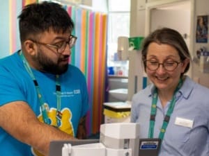 A picture of two team members from Sheffield Children's Hospital viewing System C's CareFlow Medicines Management.