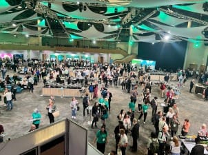 A picture of a busy exhibition hall at System C UserCon 2025