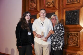 An image of Chloe receiving her Frontline Award.