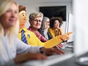 An image of Social Workers learning how to use Education Case Management on computers.